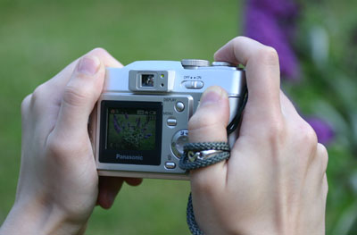 A position that shows the subject and the display, in low-contrast light that permits the display to even be seen, and the proper way of holding the camera; this was all carefully planned.