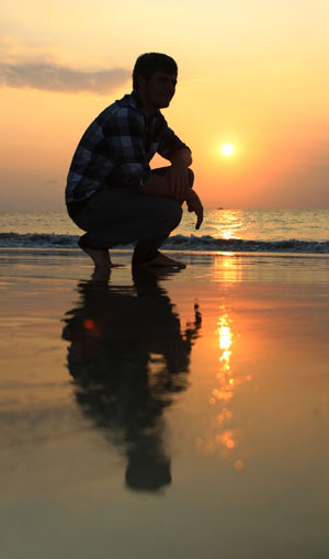 beach portrait against rising sun