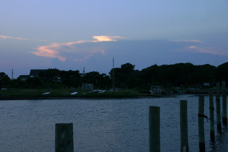 anvil cloud and accompanying rising cumulonimbis in distance