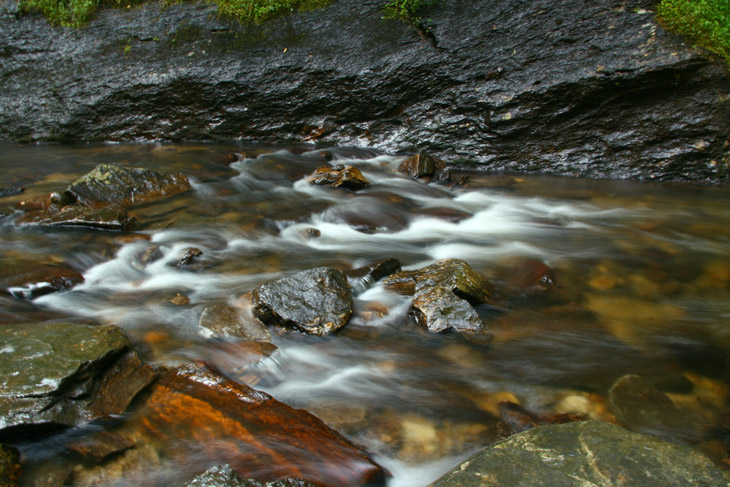 time exposure of small torrent at base of Looking Glass Falls