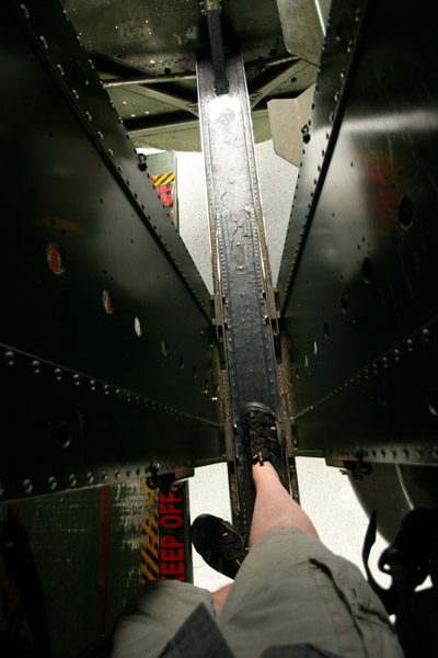 view down at author's foot on catwalk within bomb bay of Collings Foundation's B-17G "909"