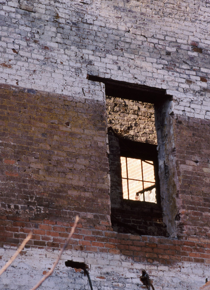 empty windows paired up in abandoned building