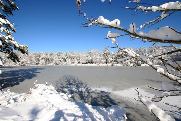 super clear sky over snowy pond