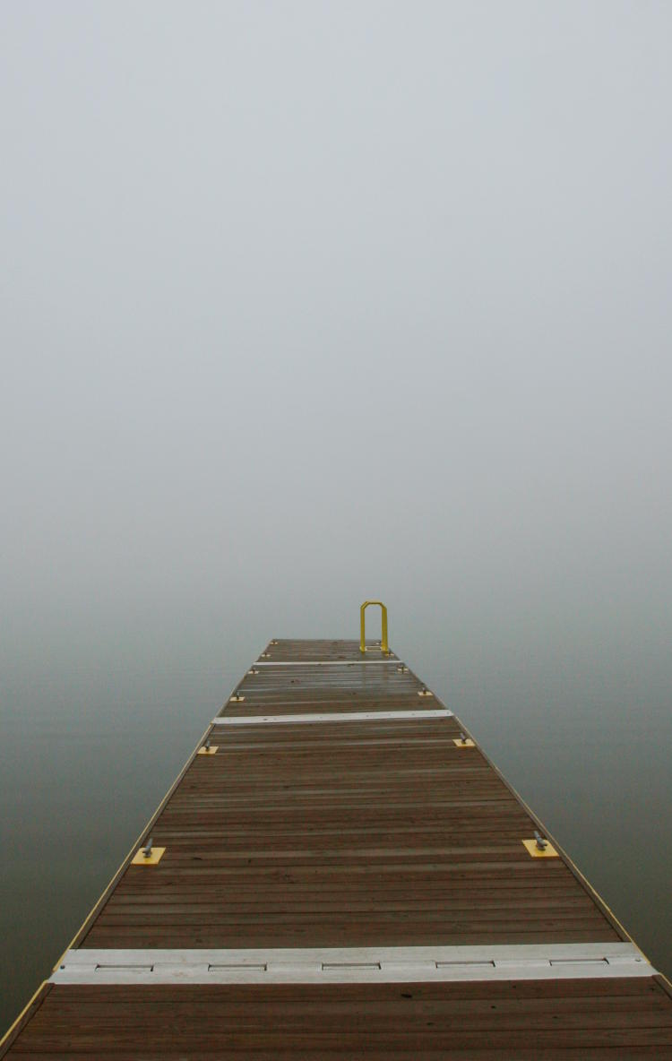 dock on foggy lake