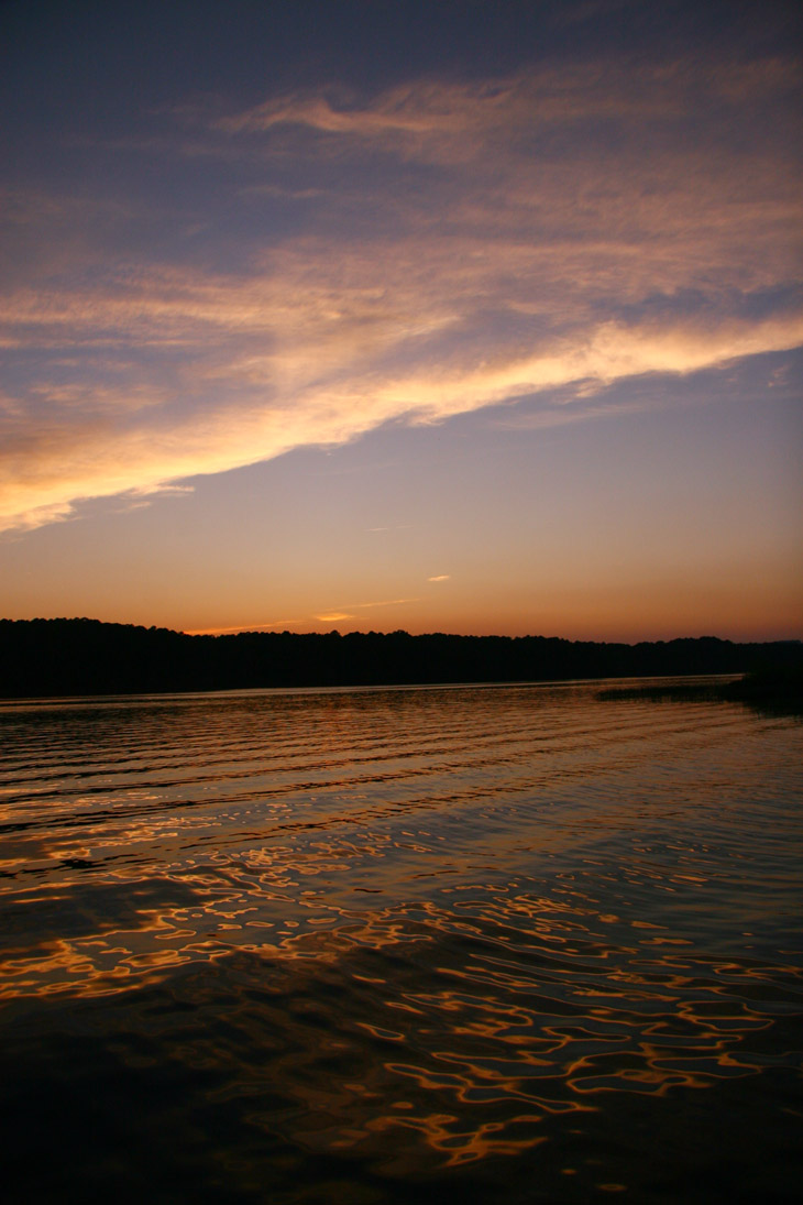 clouds and lake ripples at sunset