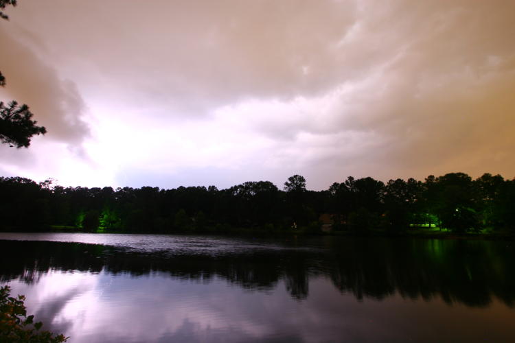 bright and close lightning strike mostly obscured by rain