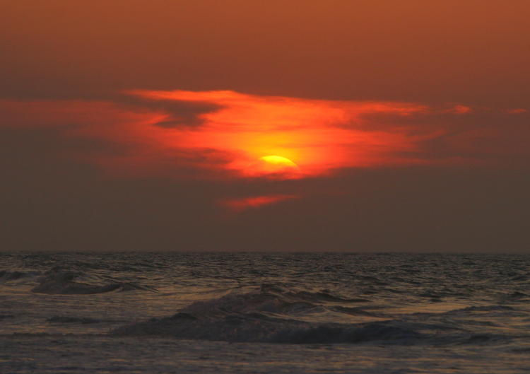 almost-obscured sunrise off North Topsail Beach