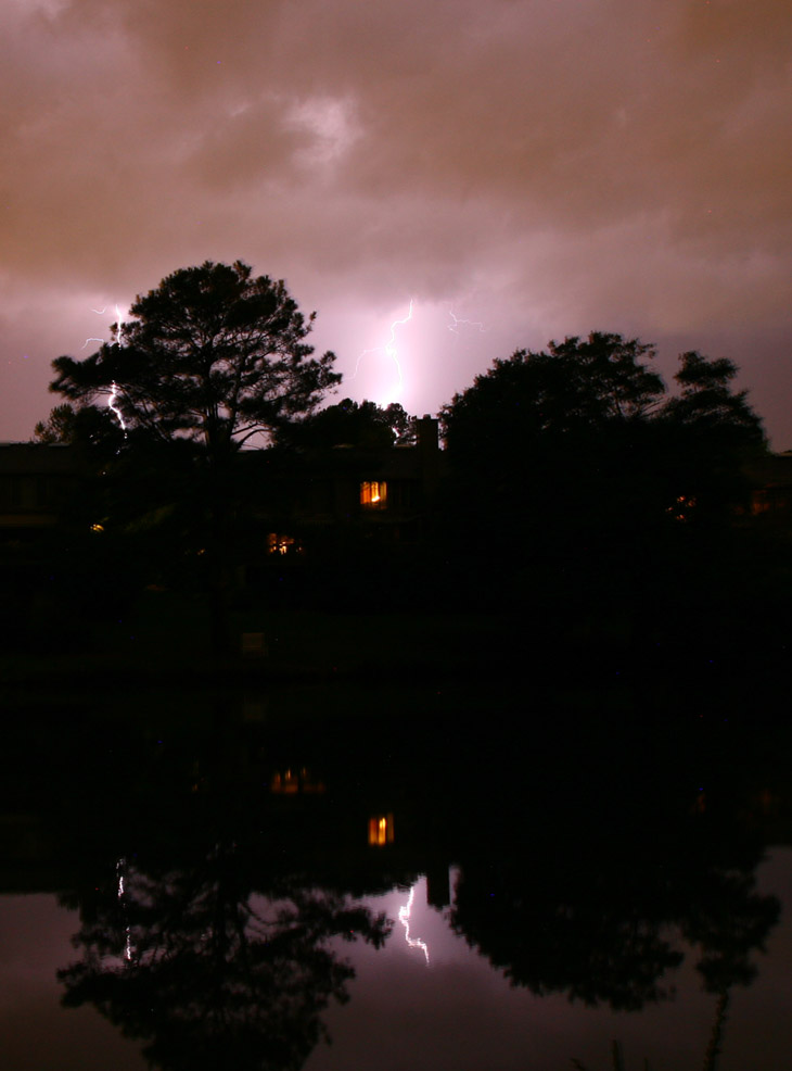 lightning finally hitting the gap between the trees