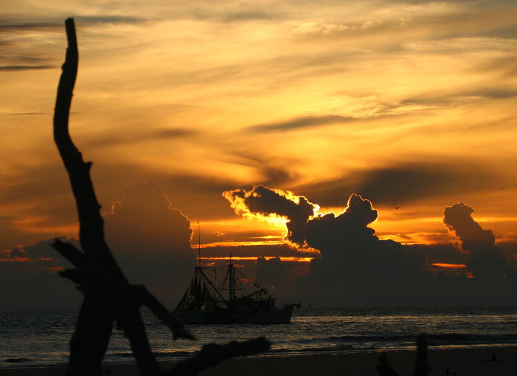 fishing boat against dramatic sunrise, Jekyll Island Georgia