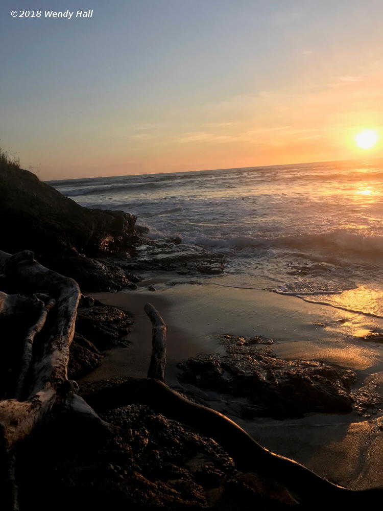 sunset along rocky shore in Costa Rica, by Wendy Hall