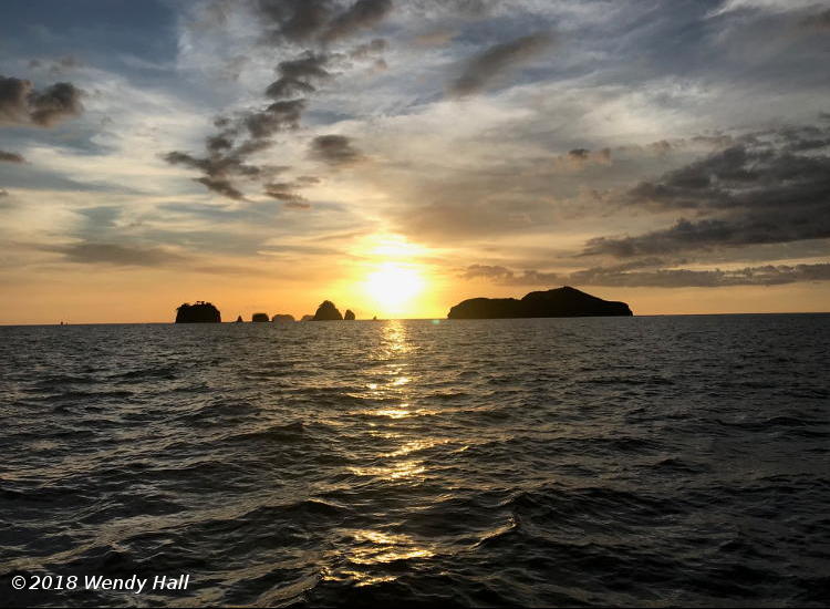 sunset among island at Costa Rica, by Wendy Hall