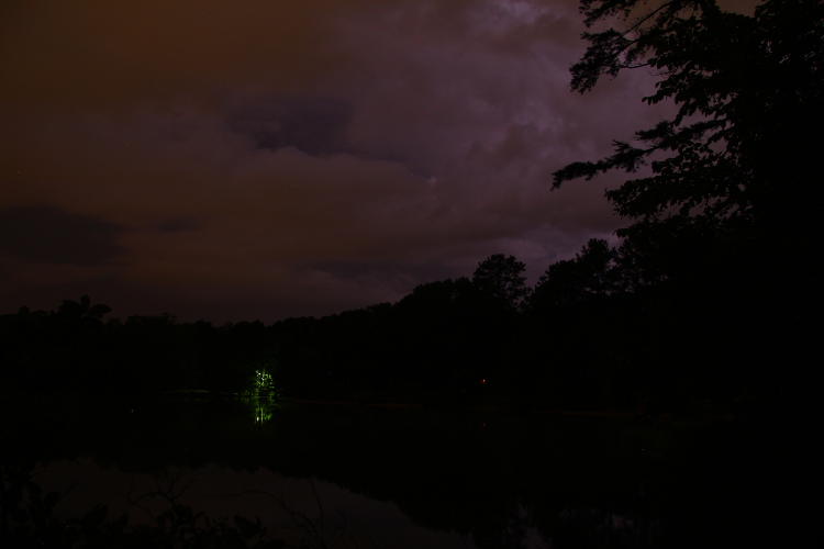 nighttime clouds illuminated by hidden lightning