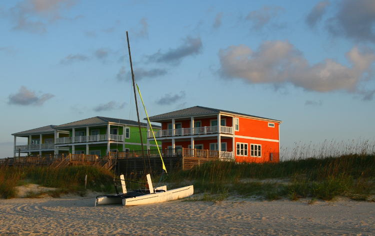catamaran in front of colorful beach houses, Oak Island NC
