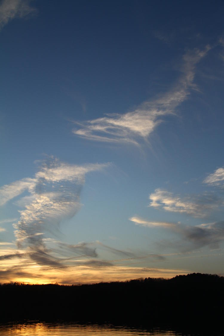 wispy clouds at sunset over Jordan Lake