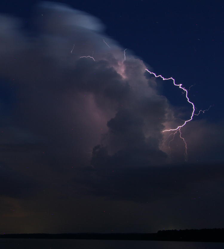 cloud lightning from thunderhead over lake