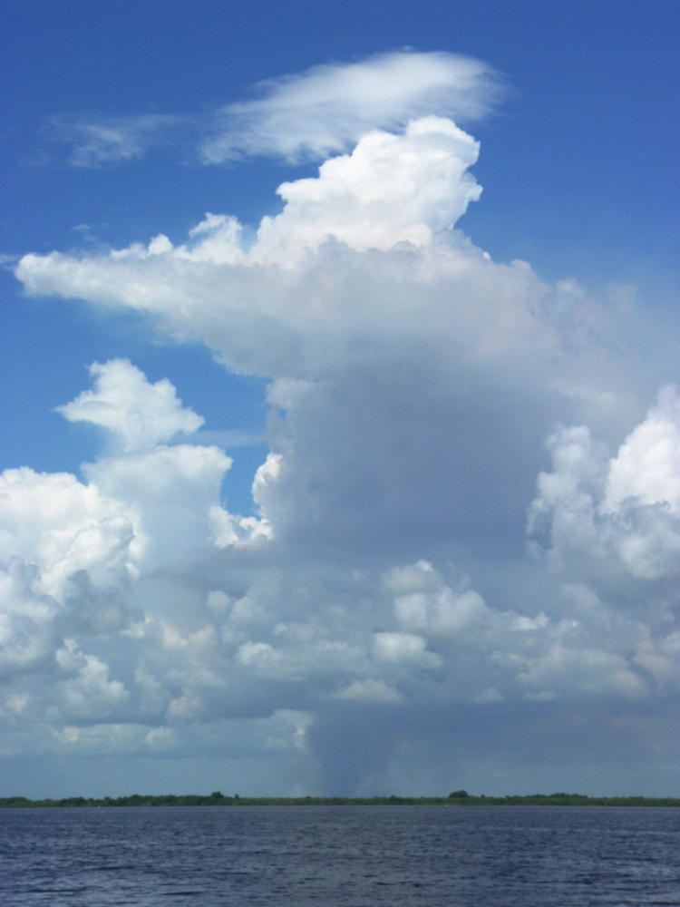 distant thunderhead and storm seen beyond Lake Washington, Florida