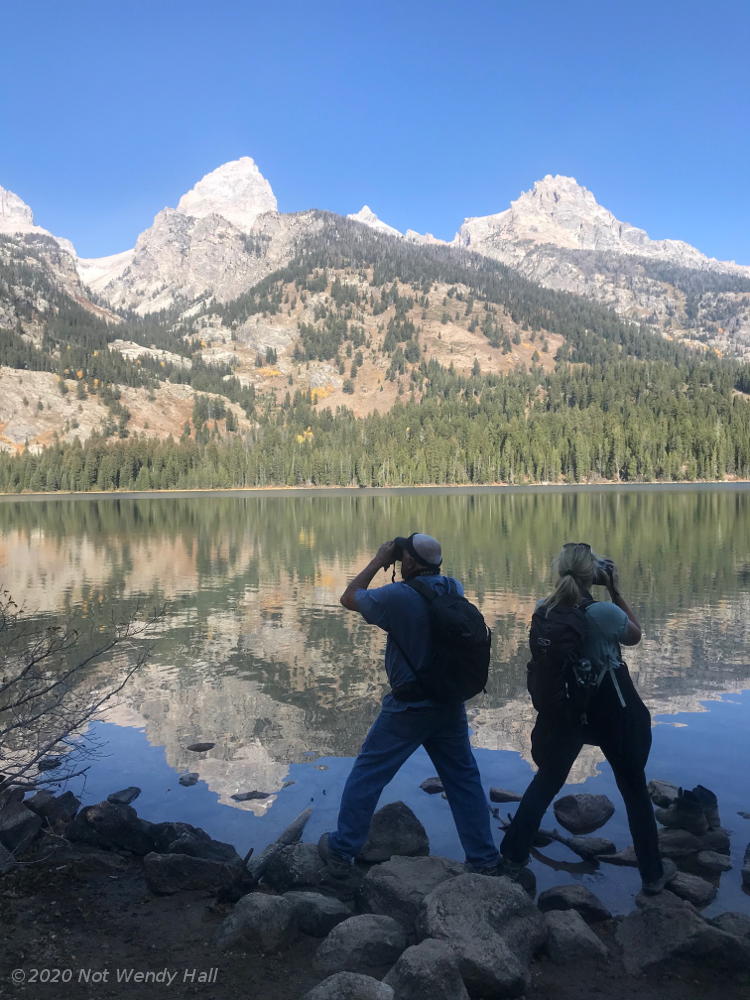 Hikers in front of Taggert Lake with Grand Tetons in background, not by Wendy Hall