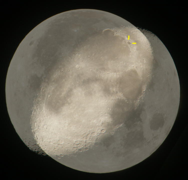 two gibbous moon phases overlapped and pinned on Plato crater