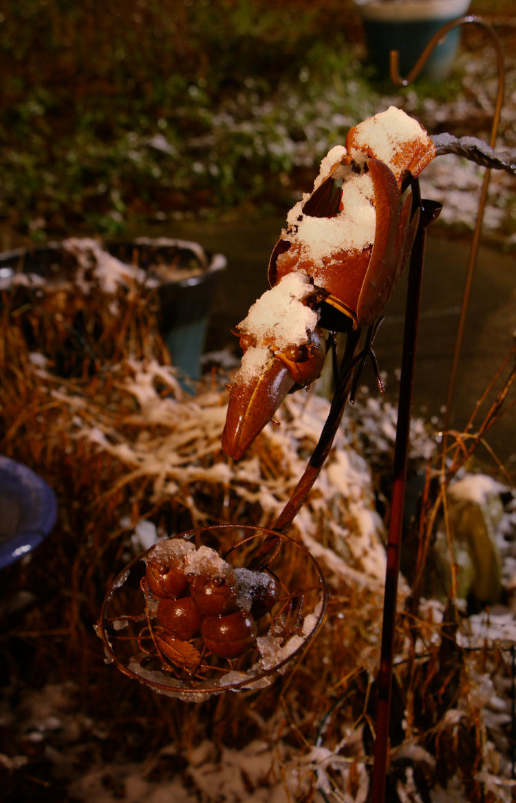 mobile sculpture with smattering of accumulated snow