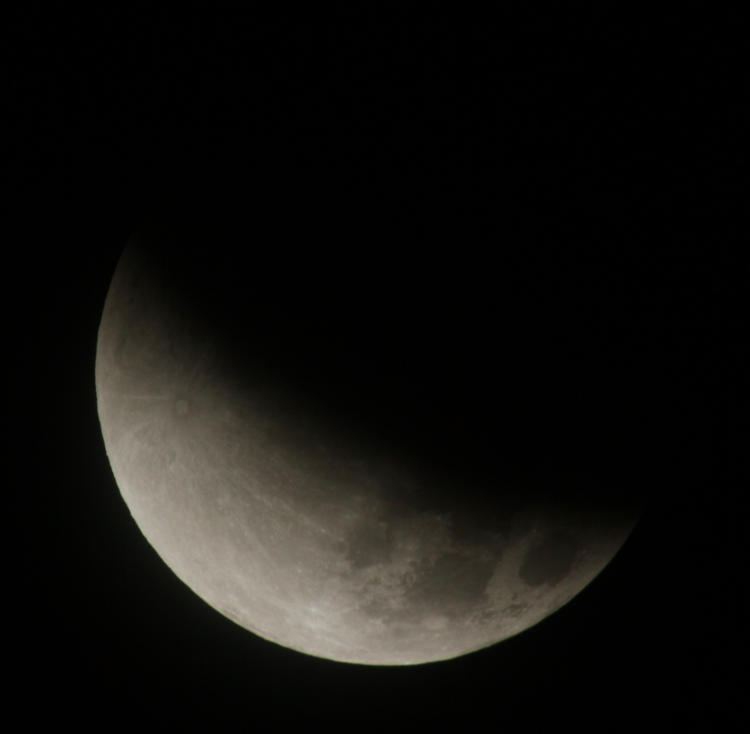 lunar eclipse slightly beyond halfway mark
