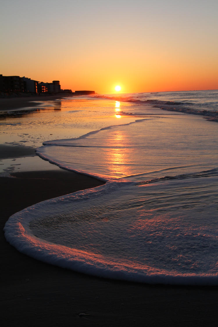 scenic sunrise over foam on North Topsail Beach