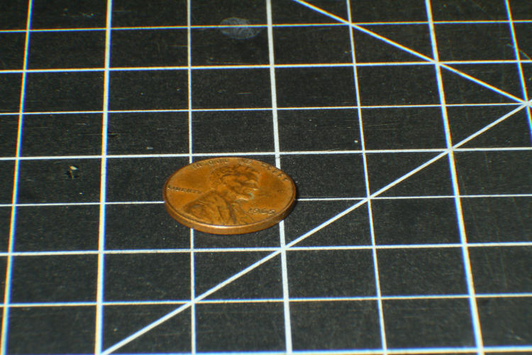 penny/cent at maximum distance from reversed Sigma 28-105 f2.8-4 at 105mm