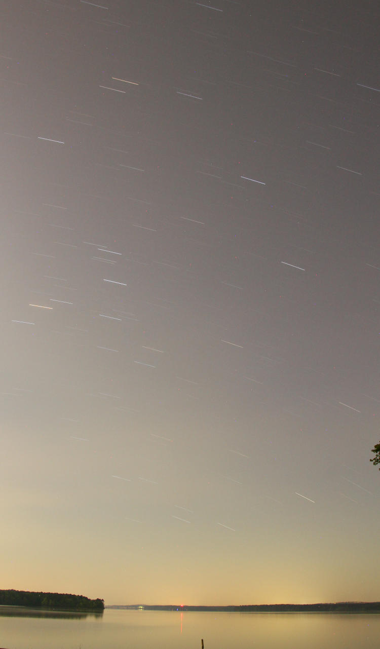 long exposure over Jordan Lake showing star trails