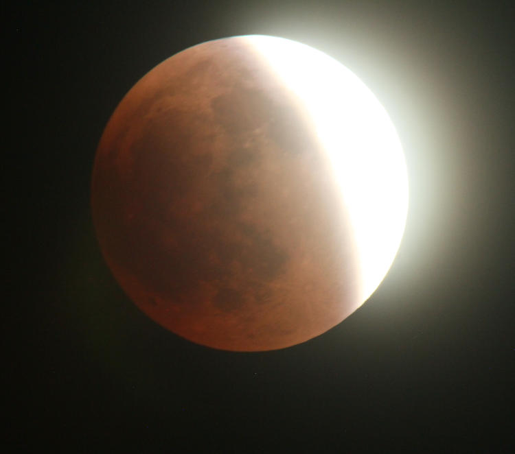 partially-eclipsed moon exposed for shadowed side