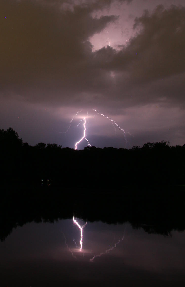 lightning emerging from bottom of cloud