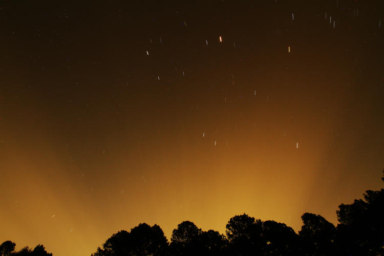 night crepuscular rays from Durham against too-humid sky