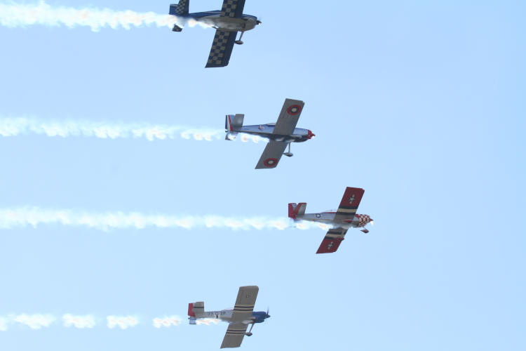 Four members of Full Throttle Formation Team passing overhead