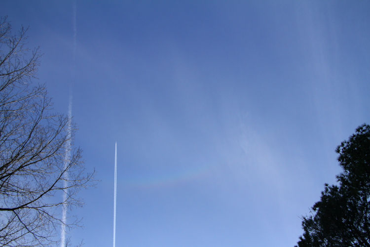 section of circumzenithal arc with plane contrail