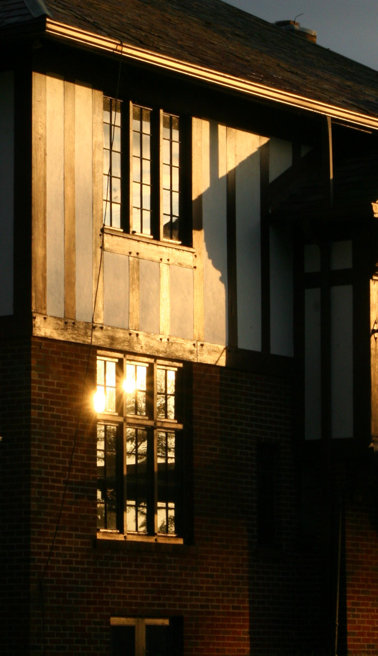 sunset on facade of old hunting lodge in New York