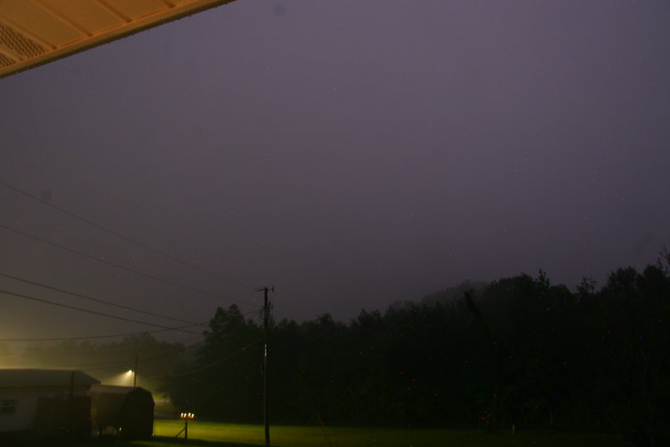 rain from violent thunderstorm in Tennessee now completely obscuring nearby peak