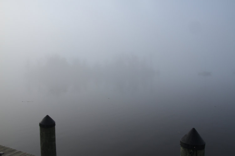 small island just visible through heavy fog on Pamlico Sound, a measured 150 meters off.