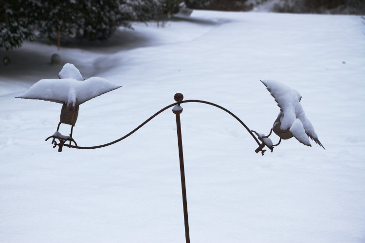 snow-covered yard balance decoration