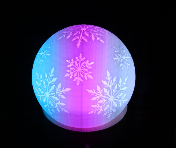 winter ornament on color-changing stand, time exposure with moving slot