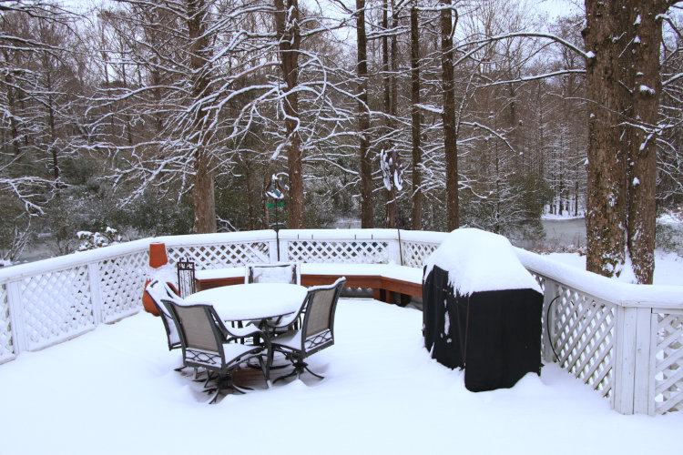 heavy snow cover on back deck of Stately Walkabout Manor