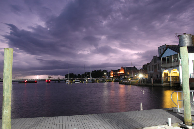 time exposure along waterfront with plenty of inter-cloud lighting