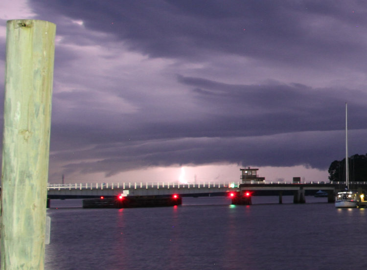 cropped inset of previous image showing lightning bolt under cloud cover