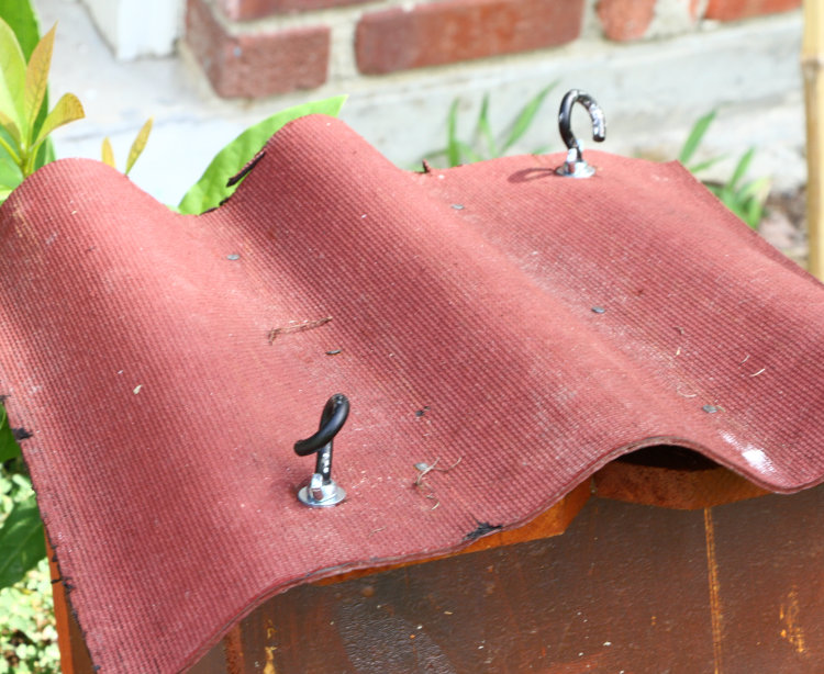 new roof of wood duck nest box with altered hanging eyes