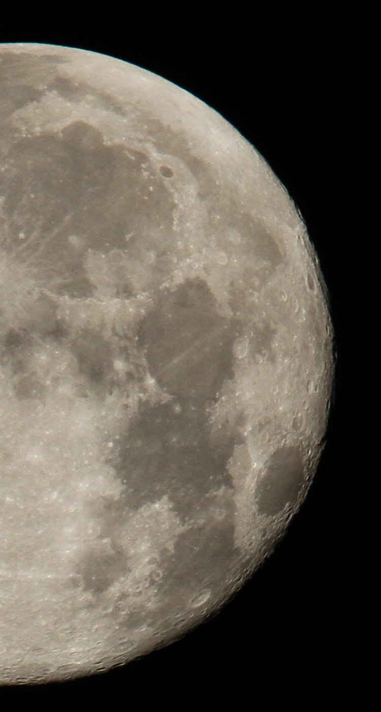 section of 2nd quarter full moon showing advancement of shadow as phase wanes