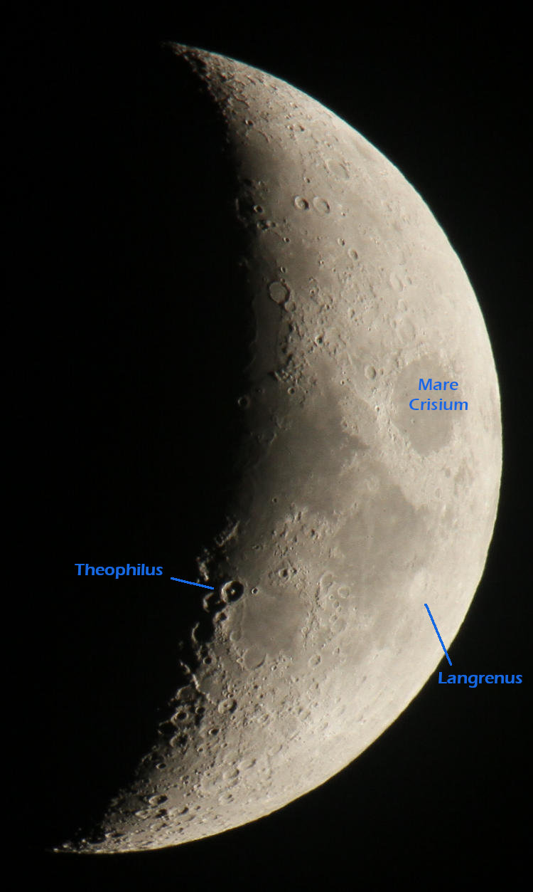 waxing crescent moon with craters marked