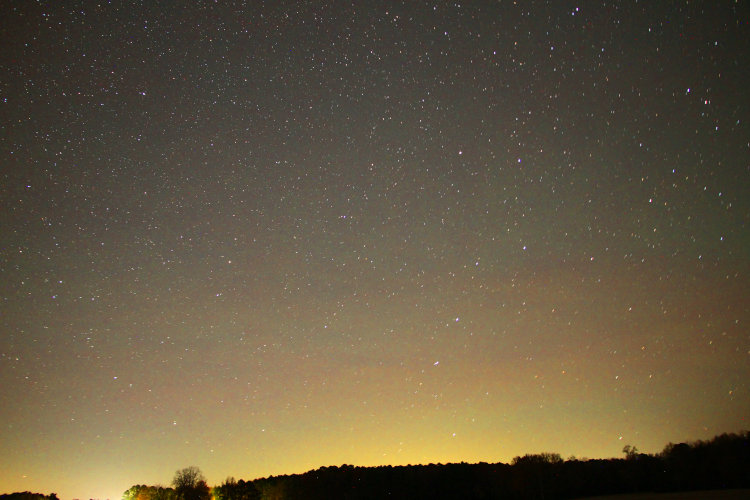view of noght sky to north with perhaps faint auroral banding, with saturation doubled digitally