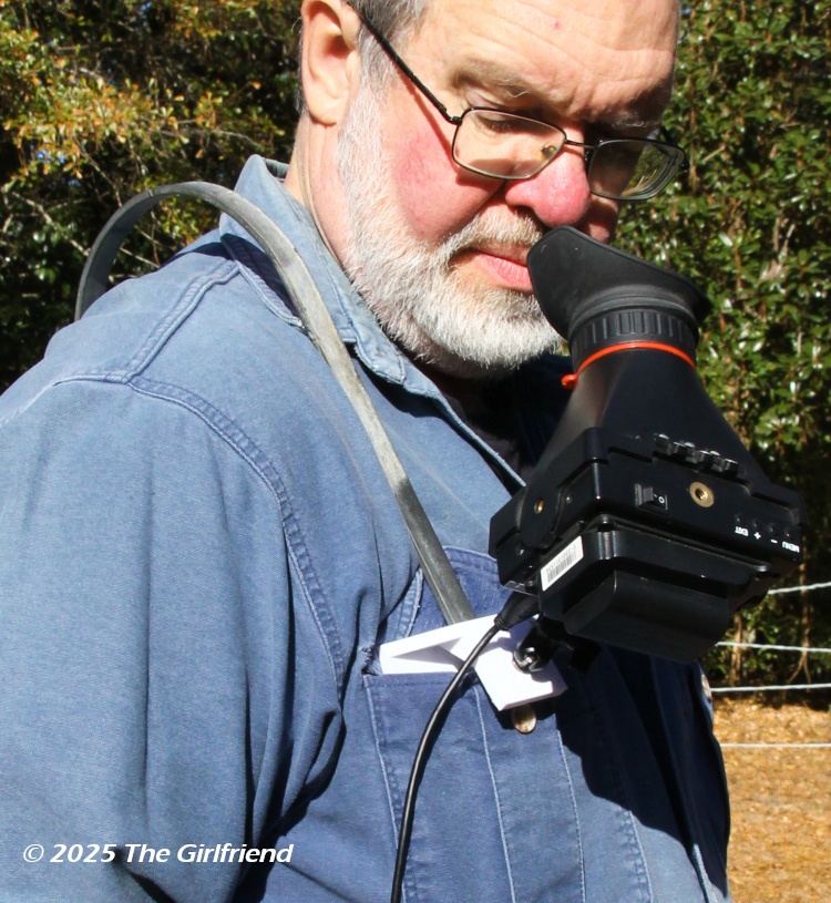 3D printed mount for off-camera HDMI monitor with curved metal shoulder brace, photo by The Girlfriend