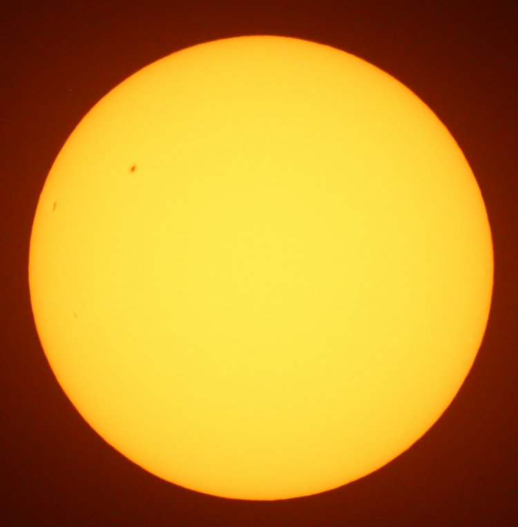 two small spots on sun's face through solar filter, Feb 28, 2026