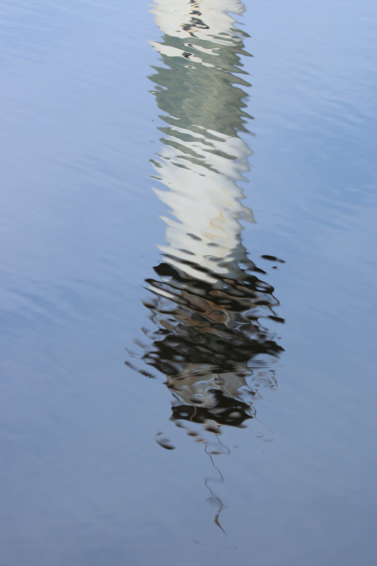 mottled reflection of Lake Mattamuskeet 'lighthouse' observation tower in pool