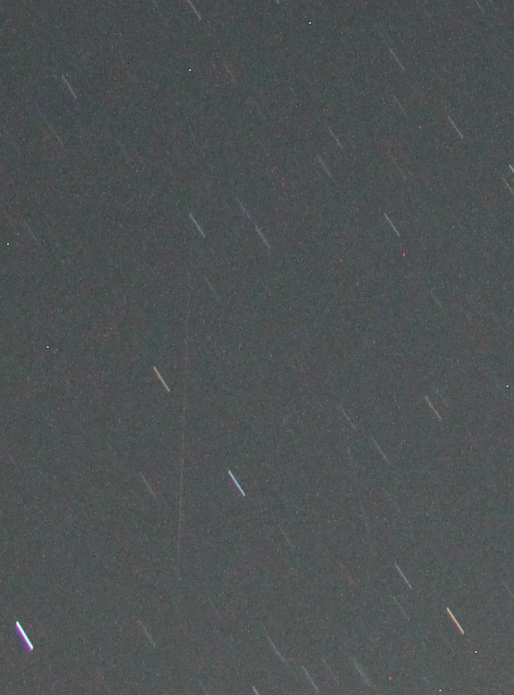 inset of two-minute time exposure of night sky with captured meteor