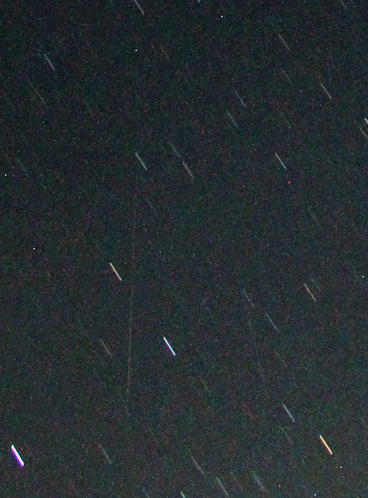 inset of two-minute time exposure of night sky with captured meteor, contrast-enhanced