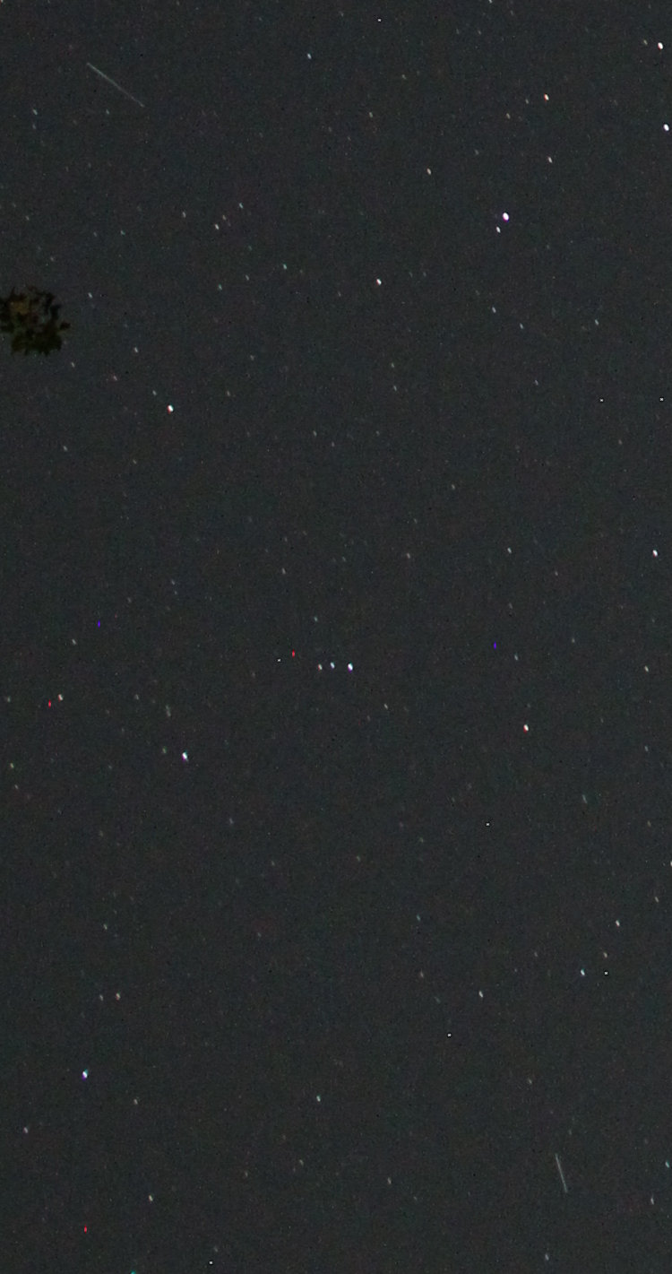 inset of time-exposure of night sky with two satellite trails
